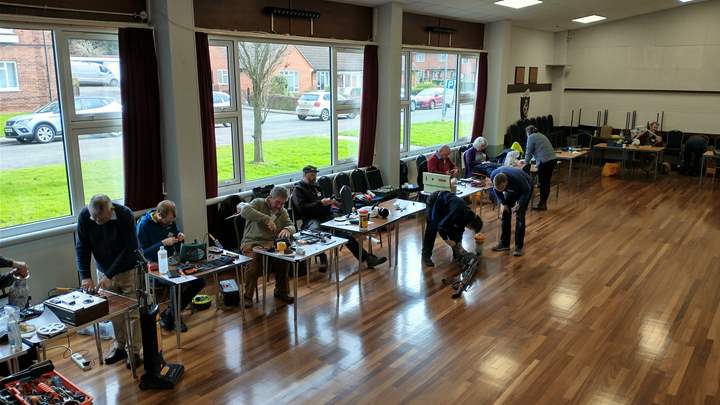 People repairing items in a  new 'repair cafe'