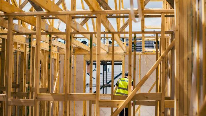 Worker at Taylor Lane building timber frame construction