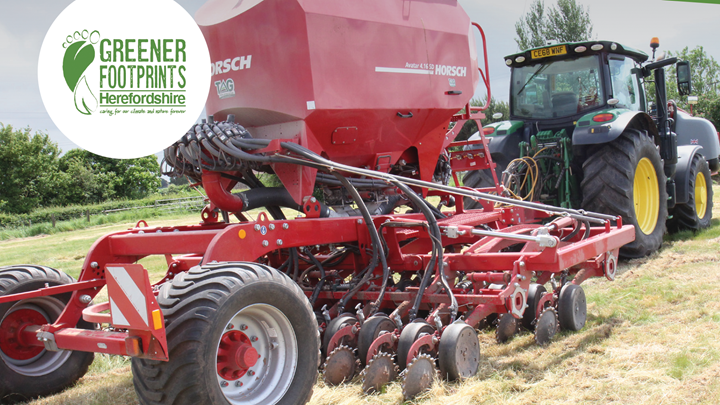 A farmer using a tractor to prepare a field.